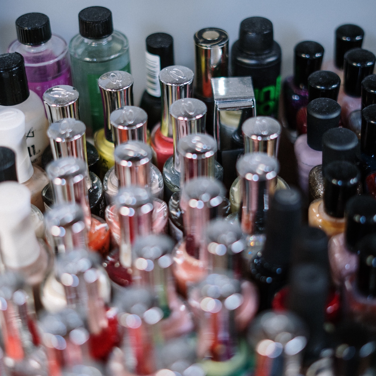 Various colours of nail paints used by the nail technician.